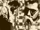 Gary Oldman,biała koszula, okulary