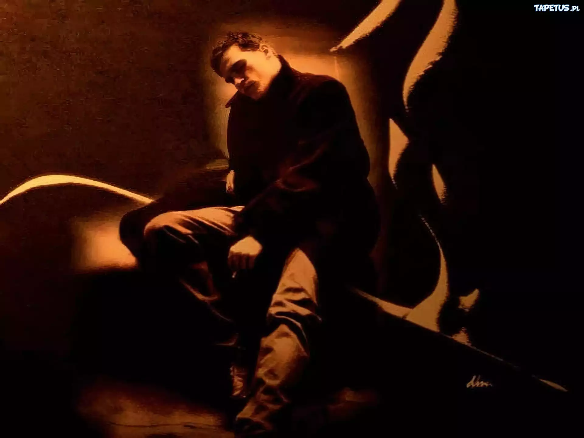Joaquin Phoenix,czarny płaszc